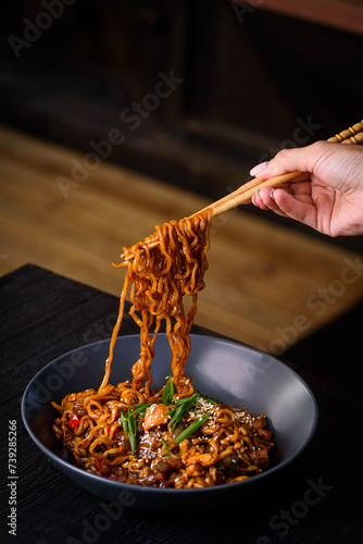 korean food. ramen, noodles on bamboo sticks