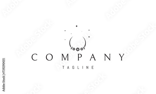 A vector logo with an abstract image of the moon with a bouquet of flowers at the base.