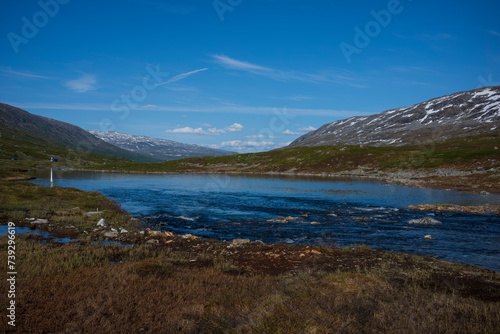 The snow capped Breiddalen Valley at Jotunheimen National Park in Norway 