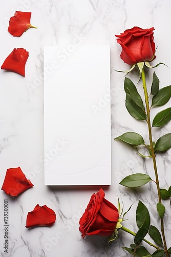 vertical mockup white blank paper sheet with red roses top view on marble stone, template empty card © Маргарита Вайс