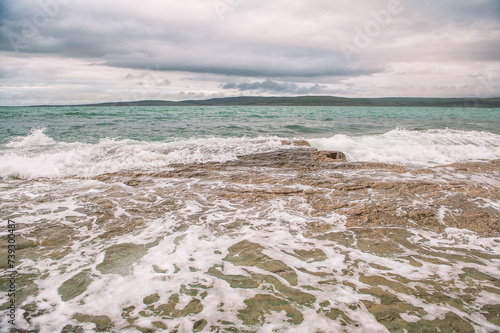 Sea waves in storm and dramatic clouds