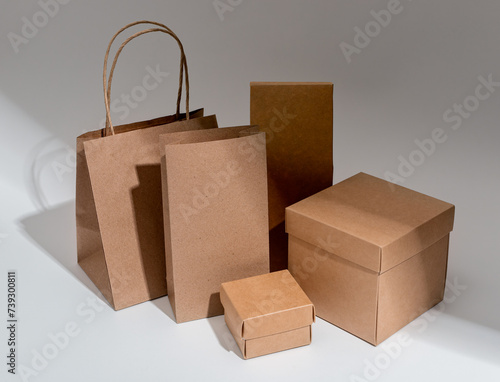 Kraft paper and cardboard packages. Craft carton packs of different size and shape