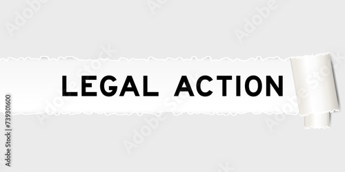 Ripped gray paper background that have word legal action under torn part