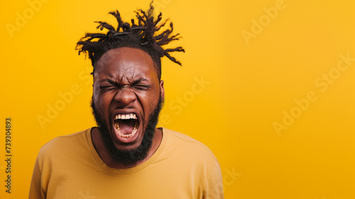 East African Man Reflecting Anger and Frustration, Isolated on Solid Background - Copy Space Provided
