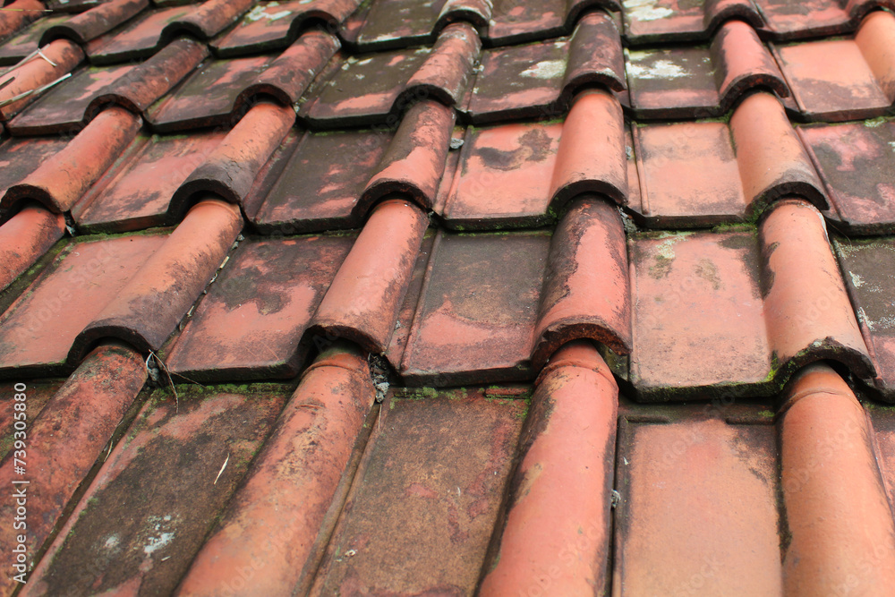 Traditional aged clay roof tile background Traditional aged clay roof tile background