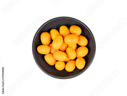 Fruit kumquat in a bowl isolate