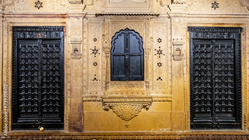 Antique traditional solid wooden doors and window in jaisalmer Haveli