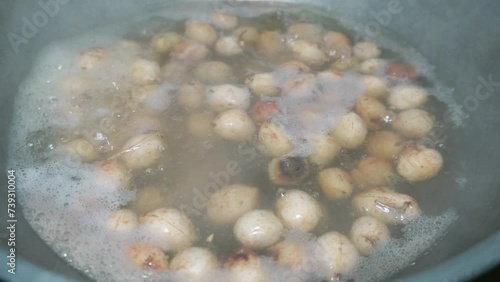 the process of cooking boiled Bogor peanuts (Bambara groundnuts) which are soaked in water until boiling photo