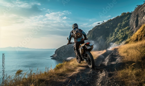 Back view of man riding a off-road motorcycle, going up to steep cliff.