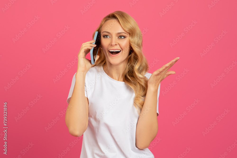 Happy Blonde Woman Talking On Phone Over Pink Studio Backdrop Happy Blonde Woman Talking On Phone Over Pink Studio Backdrop
