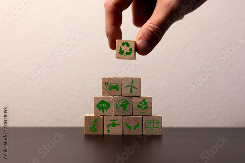 Carbon credit concept. Tradable certificate to drive industry and company in the direction of low emissions in efficiency cost. Wooden cubes with CO2, US dollars and carbon offsetting solution icons.