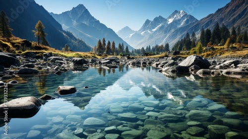 A tranquil mountain lake, crystal clear waters reflecting the towering peaks, a gentle mist rising f © ProVector