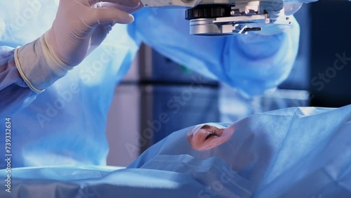 An ophthalmic surgery specialist performs an operation. Close-up. A male doctor performs a high-precision operation. Femtolaser cataract surgery.