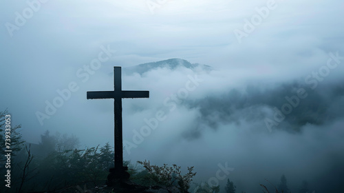 cross silhouette with mist, ethereal mountain backdrop