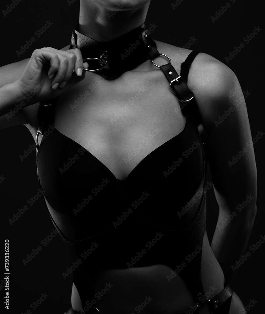 Beautiful girl body with black sexy underwear on a black background.  Sexy body, close up nudity - obrazy, fototapety, plakaty 