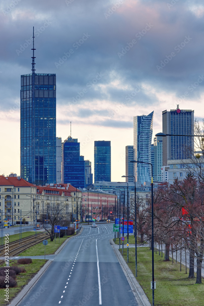 City center district along Niepodleglosci avenue with Varso Tower and downtown skyscrapers, vertical view.