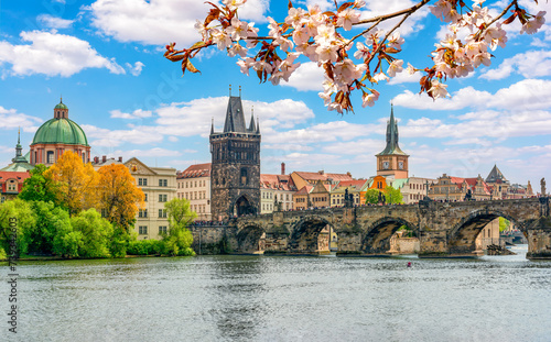 Prague cityscape with Old Town bridge Tower and Charles bridge over Vltava river in spring, Czech Republic