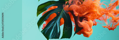 Monstera Leaf with Orange Ink Cloud on Turquoise Background