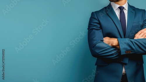 confident businessman in blue suit arms crossed standing, banner cocnept with space for text or product photo