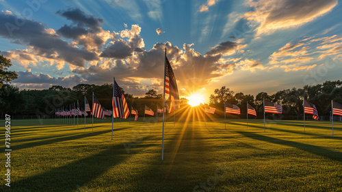 Sunset casting long shadows over a field of American flags, evocative and peaceful, Memorial Day remembrance and national pride
