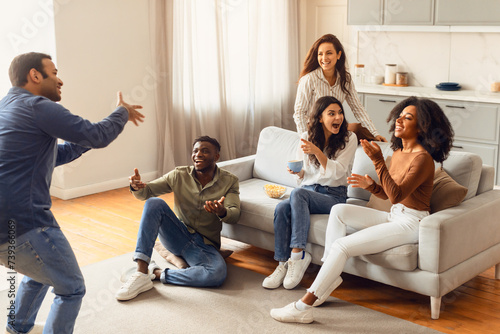 International students gathering in living room for game of charades