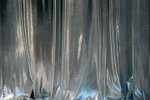 Silver fashionable curtains, fabric in the theatre, night club as texture or background