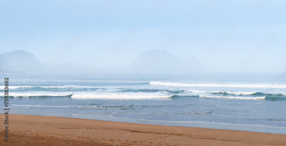 Fototapeta premium Cantabrian Sea. Zarautz beach and Ratón de Getaria in the waters of the Cantabrian Sea, Euskadi.