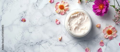 Aromatic whipped cream in a decorative bowl surrounded by blossoming flowers