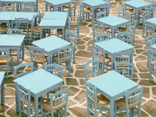 Empty tables and chairs of a taverna