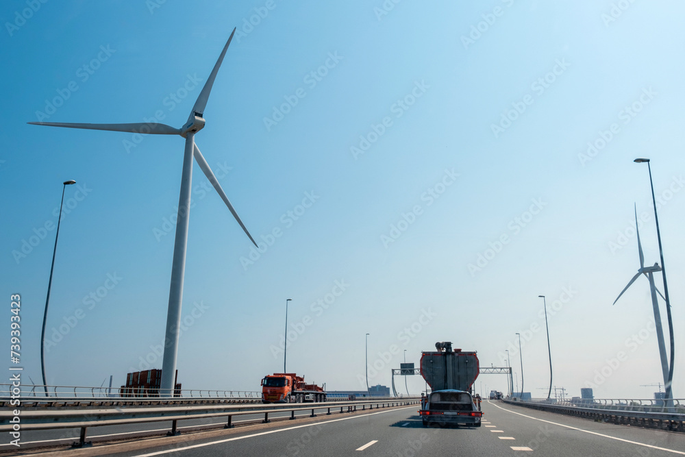 windmill truck highway road Europe Netherlands urban traffic smoke pollution