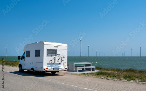 White Trailer road windmill north sea blue sky Netherlands camp trip