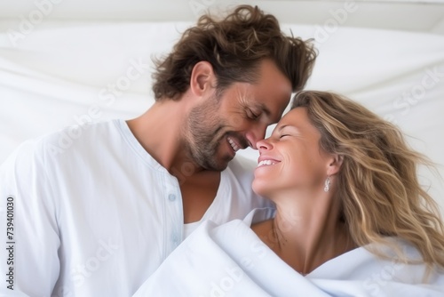 Happy couple embracing and dreaming of moving into their new dream home against a white background