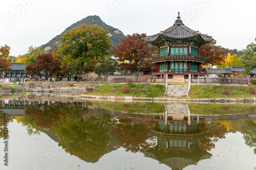 Seoul city   South Korea - 26 October 2022  Sunset Hyangwonjeong Pavilion in Gyeongbokgung Palace with Autumn season and cityscape background  Seoul city   South Korea