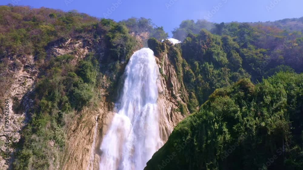 Powerful waterfall in the mountains Powerful waterfall in the mountains