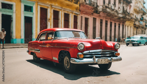 retro red car on a sunny street in havana, cuba 