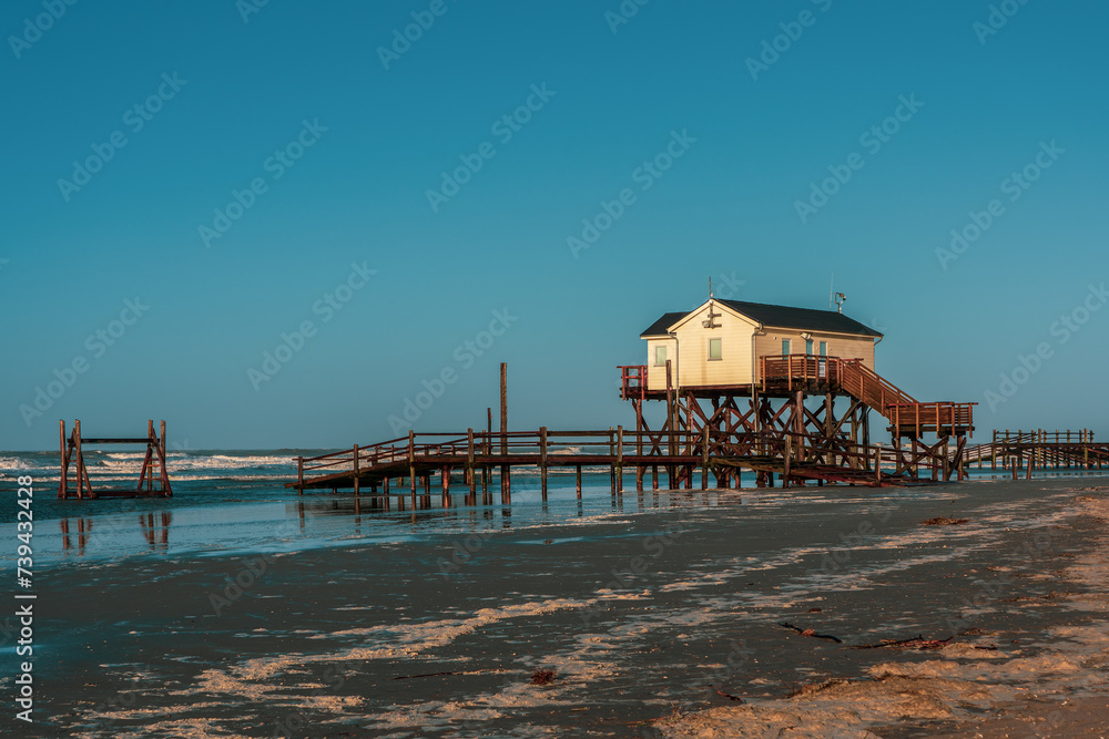 Pile dwelling on the beach of Sankt Peter-Ording in Germany.