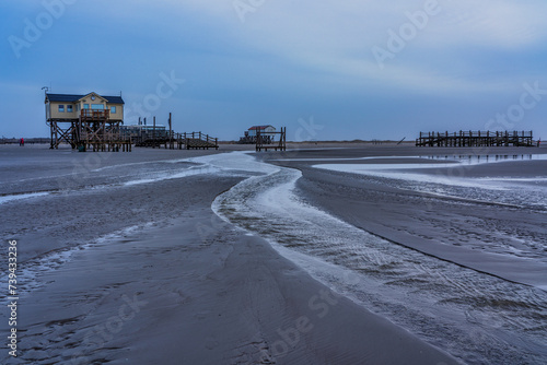 Pile dwelling on the beach of Sankt Peter-Ording in Germany.