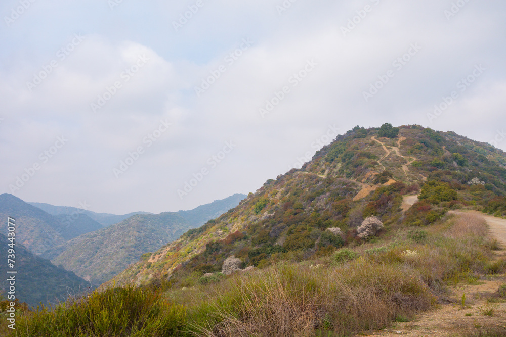 Views while gravel biking in the Santa Monica Mountains on Sullivan Ridge during an overcast day.