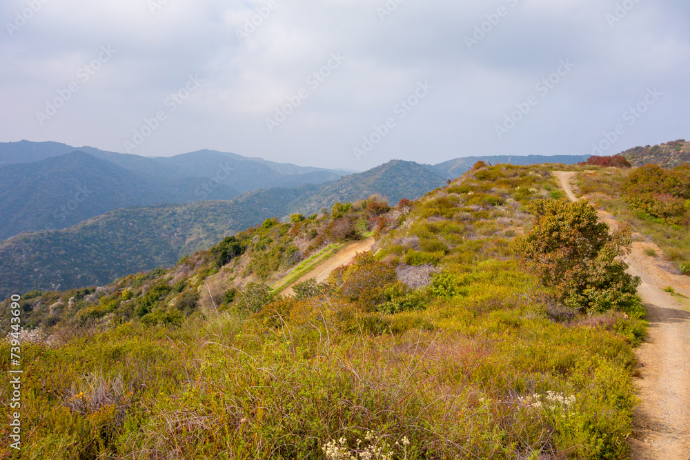 Views while gravel biking in the Santa Monica Mountains on Sullivan Ridge during an overcast day. Views while gravel biking in the Santa Monica Mountains on Sullivan Ridge during an overcast day.