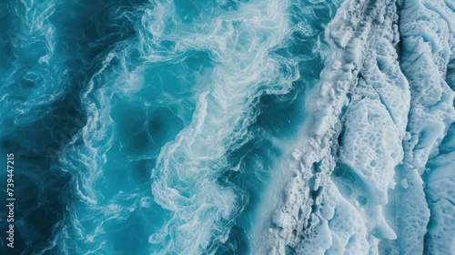 An aerial perspective showcasing the mesmerizing expanse of glacial water, with its icy blue hue stretching out into the horizon, creating a serene and captivating natural scene.