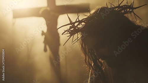 Jesus Christ with crown of thorns on his head and cross in the background