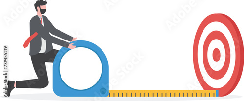 Business success measurement, how far from business goal and achievement or growth metric analysis concept, smart businessman using measuring tape to measure and analyze distance from target.

