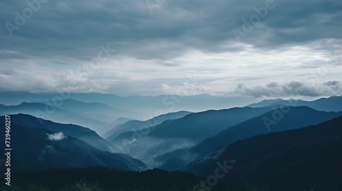 Mountains with sea fog below misty mountain top and cloud bed view 