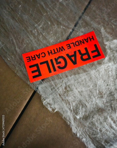 Moving boxes with fragile sticker on a background