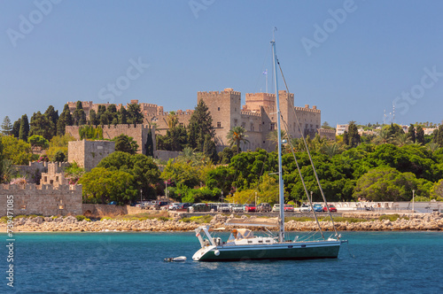 A picturesque view of the city embankment and the fort of Rhodes on a sunny day.