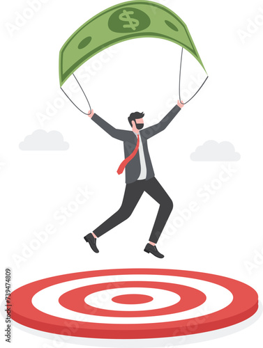 Businessman with parachute landing on the target. Business success concept.

