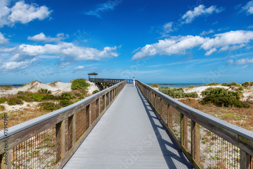 Smyrna Dunes Park with elevated boardwalk and fishing pier in New Smyrna Beach, Florida. photo