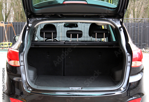 Rear view of a SUV car with open trunk. Ready for luggage loading. © Best Auto Photo