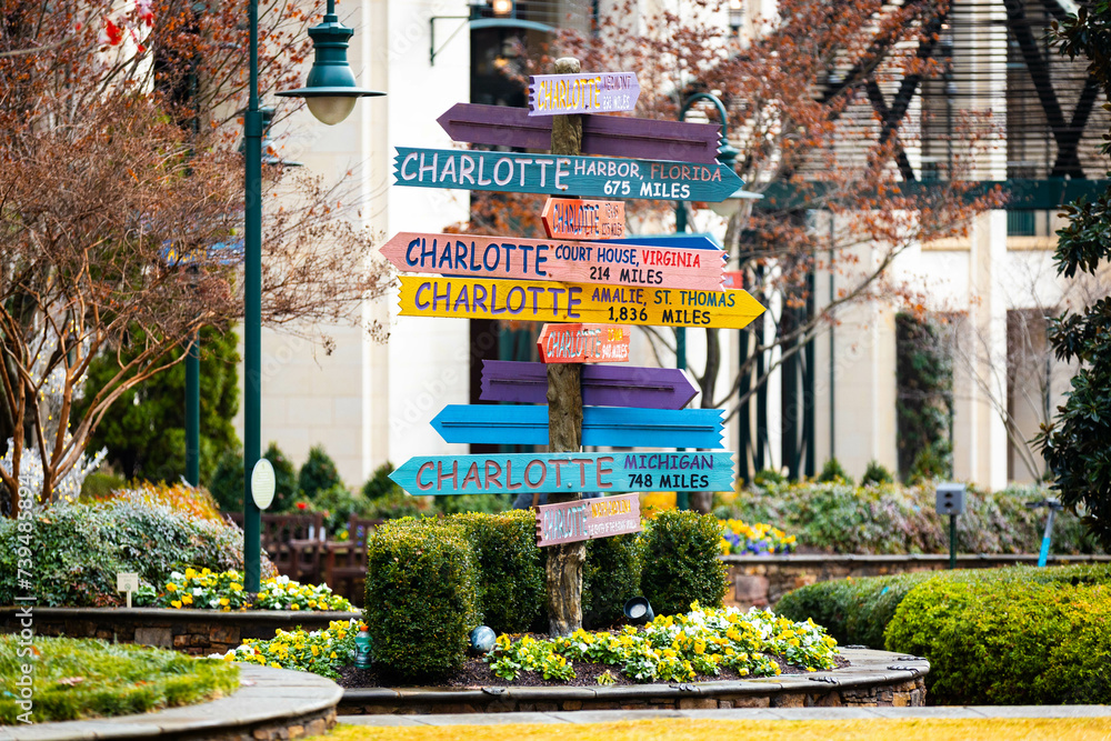 Colorful directions signs in Charlotte The Green city center park