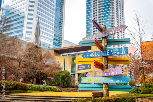 Colorful directions signs in Charlotte The Green city center park photo